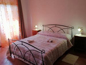 Posteľ alebo postele v izbe v ubytovaní La Casa del Gigli