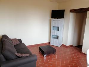 Televízia a/alebo spoločenská miestnosť v ubytovaní La Casa del Gigli