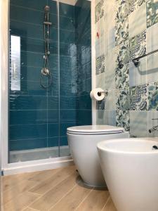 a bathroom with a toilet and a shower at B&B Margherita in Marina di Camerota