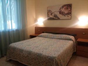 Postel nebo postele na pokoji v ubytování Hotel Astor Victoria