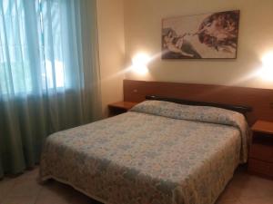 Postel nebo postele na pokoji v ubytování Hotel Astor Victoria