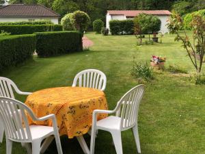 a table with two chairs and a table with a table cloth at Apartment 4 in Wyk auf Föhr