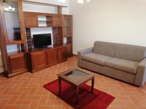 Televízia a/alebo spoločenská miestnosť v ubytovaní La Casa del Gigli