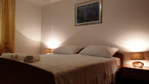 Postel nebo postele na pokoji v ubytování Apartman Biserka
