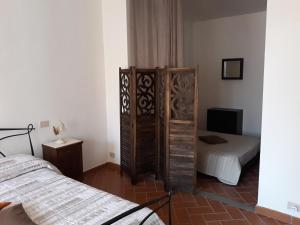 Posteľ alebo postele v izbe v ubytovaní La Casa del Gigli