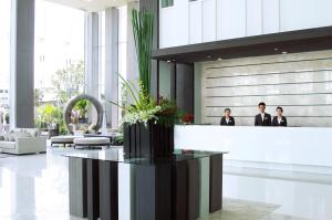 a lobby with three people in a building at Classic Kameo Hotel & Serviced Apartment, Rayong in Rayong +32 photos