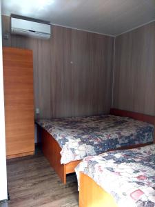 Postel nebo postele na pokoji v ubytování Mini Hotel Уютный дворик