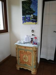 a small table with a tea set on top of it at Casa Gelsomino in Carlentini