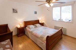 a bedroom with a bed and two night stands at Angels Inn in Coutevroult
