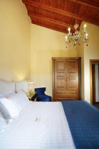 Кровать или кровати в номере Casa Bella Chania