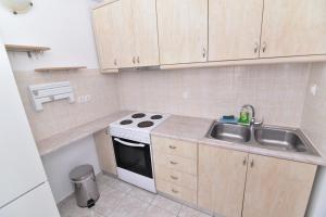 A kitchen or kitchenette at Paradiso Boutique