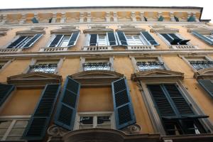 a row of windows in a building at La Superba Rooms & Breakfast in Genoa