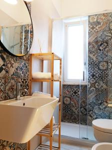 a bathroom with a sink and a mirror at Casa vista Mare in Torre Canne