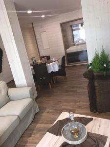 a living room with a couch and a table at Ferienwohnung Zum alten Rathaus in Schleiden