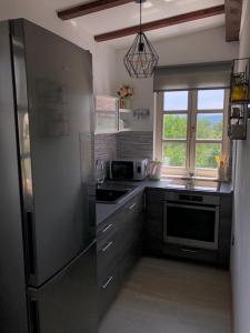 Kuchyň nebo kuchyňský kout v ubytování Studio apartman Braco