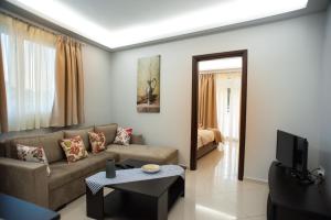 a living room with a couch and a television at DREAM APPARTMENT 1 PEREA in Perea