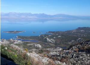 a view of a large body of water with mountains at Livari Viewpoint in Livari