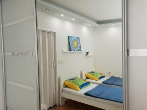 Łóżko lub łóżka w pokoju w obiekcie Apartment Split