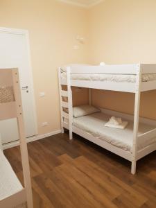 Posteľ alebo postele v izbe v ubytovaní Glam Resort G H O S T E L