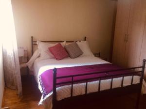 Postel nebo postele na pokoji v ubytování La Casa de las Flores