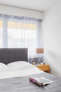 Ein Bett oder Betten in einem Zimmer der Unterkunft Swiss Star Zurich Oerlikon - contactless self check-in