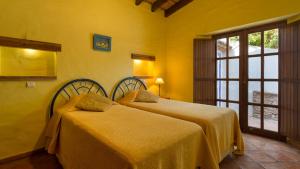 Ένα ή περισσότερα κρεβάτια σε δωμάτιο στο Casinhas Wheelchair friendly +11 φωτογραφίες