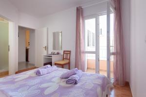 Postel nebo postele na pokoji v ubytování Villa Nedika