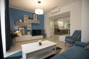 a living room with a couch and a table at Appartamento Roberto House in Fertilia