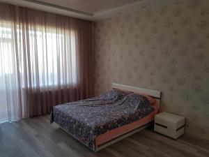 Ένα ή περισσότερα κρεβάτια σε δωμάτιο στο New apartment on Parkovaya +4 φωτογραφίες
