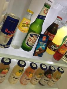 a refrigerator filled with lots of bottles of drinks at Casa di Angela in Sciacca