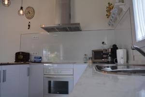 Kuchyňa alebo kuchynka v ubytovaní Casita de María