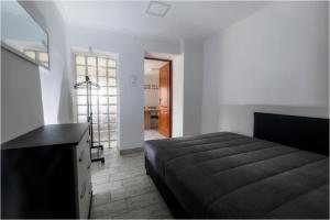 Postel nebo postele na pokoji v ubytování Róma Apartmanház