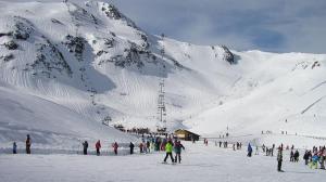 a group of people standing on a snow covered mountain at El Lagar in Aller