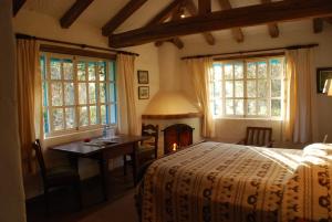 A bed or beds in a room at Las Palmeras Inn