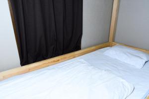 Postel nebo postele na pokoji v ubytování Hostel Hana An