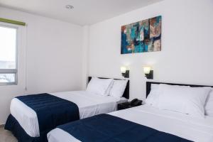 Postel nebo postele na pokoji v ubytování Hotel MB + 25 fotografií