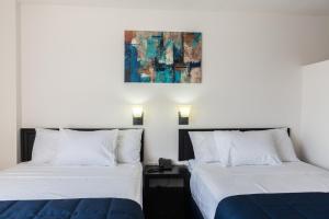Postel nebo postele na pokoji v ubytování Hotel MB
