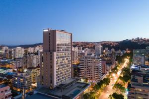 a tall building in a city at night at Novotel Vina del Mar in Viña del Mar
