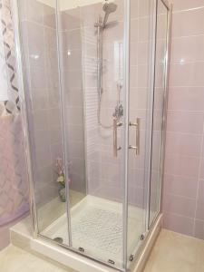 a shower with a glass enclosure in a bathroom at B&B la casetta di Lilly in Amelia +17 photos