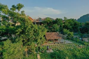 an overhead view of a building in a park at Phong Nha Village House in Phong Nha