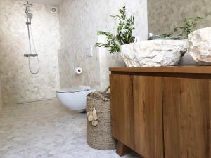 a bathroom with a sink and a bath tub at Luxury Family Beach Front Villa - SUNDAY BEACH HOUSE in Slatine +69 photos