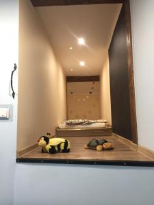 a mirror in a room with stuffed animals on the floor at Gościna U kowala in Lachowice +76 photos