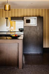 Kuchyň nebo kuchyňský kout v ubytování Bolton Hotel