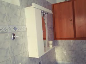 Koupelna v ubytování Pitini + 18 fotografií