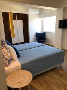 Postel nebo postele na pokoji v ubytování Elpida Beach Studios
