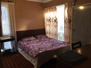 Postel nebo postele na pokoji v ubytování ADA Homestay