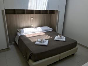 Säng eller sängar i ett rum på Time Out ApartHotel
