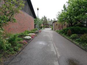 an empty sidewalk next to a brick building at Scandinavian Sleeping & Living Home Stay Experience in Turku +16 photos