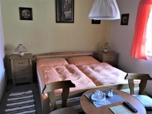 Postel nebo postele na pokoji v ubytování Penzion Trattoria