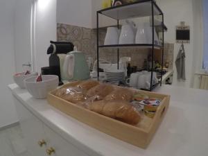 a loaf of bread sitting on a counter in a kitchen at Your home near to the Vatican in Rome